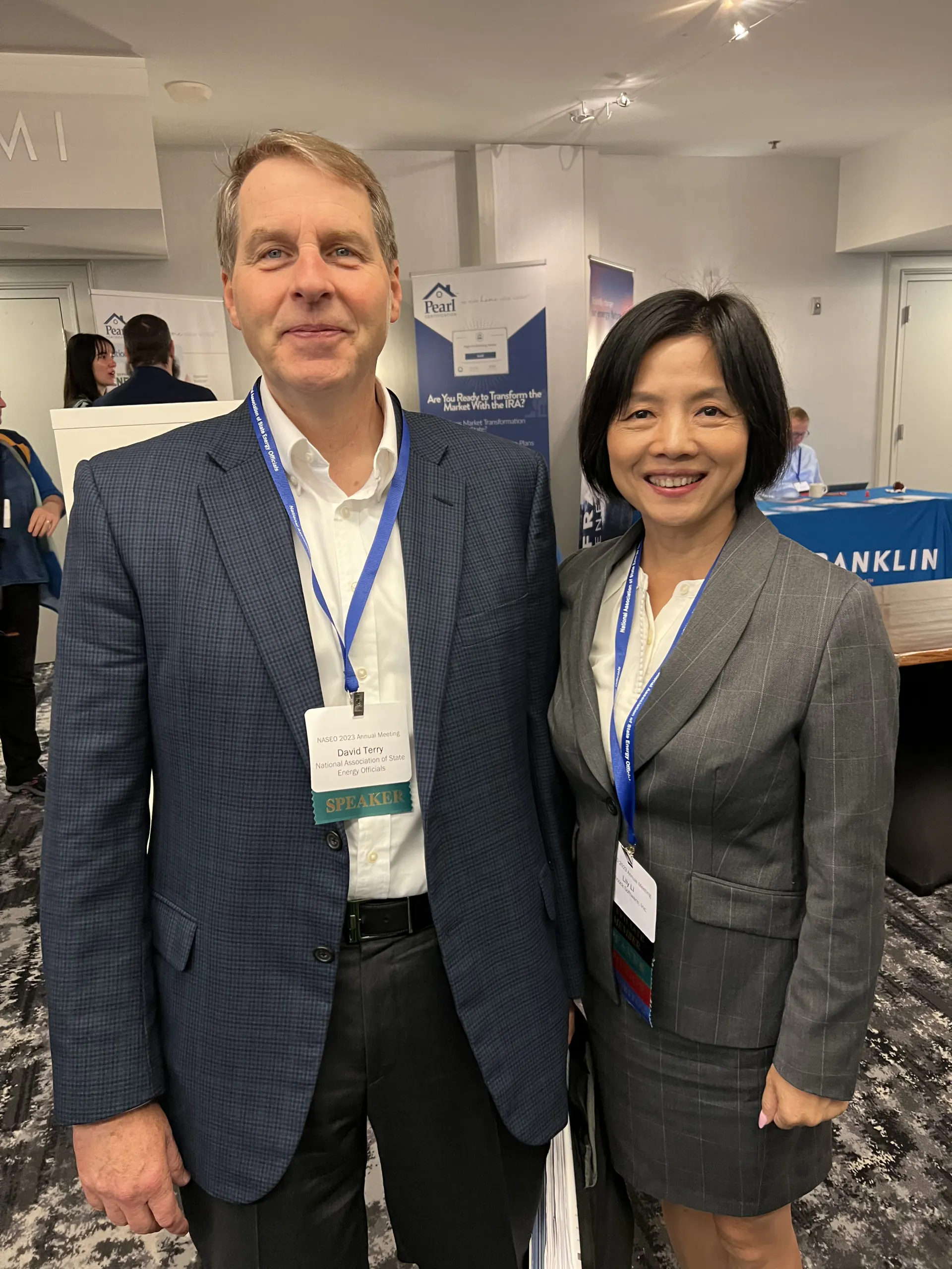 Lily Li with an energy-sector colleague
